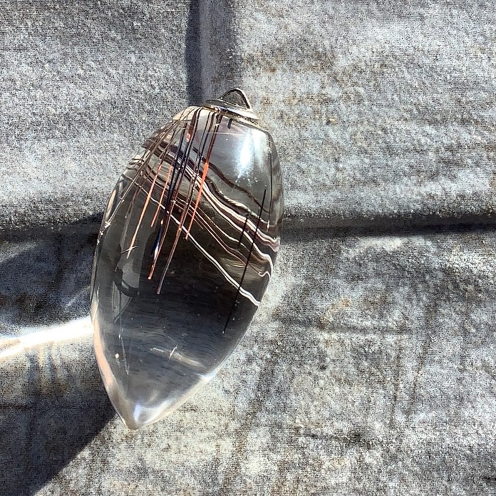 Rutilated Quartz pendant, measures 1 1/2 inches.